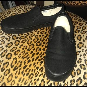 Black Vans slips ons